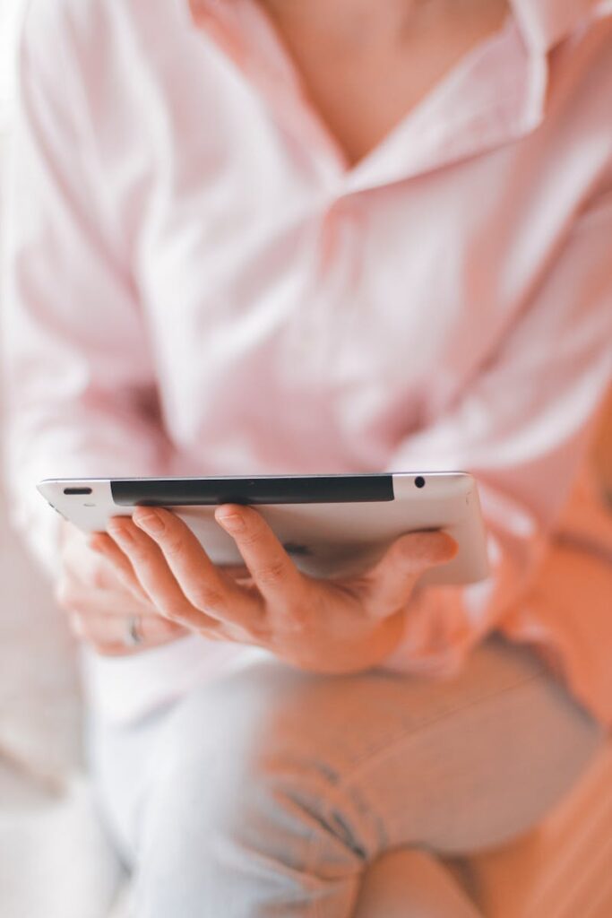 Woman Holding Digital Tablet
