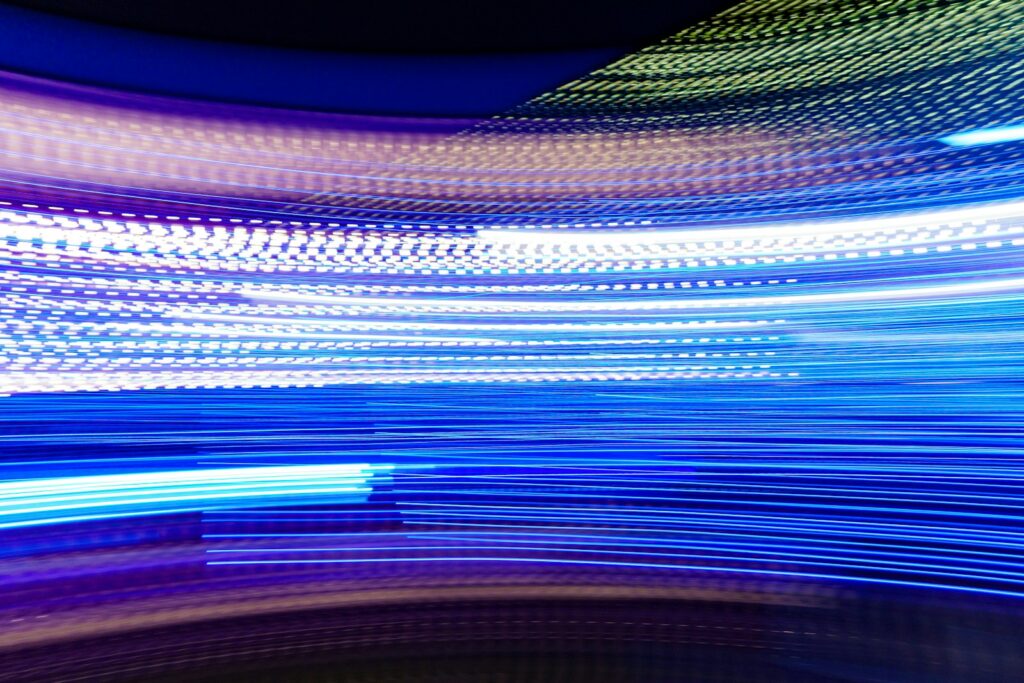 a blurry photo of blue and white lights