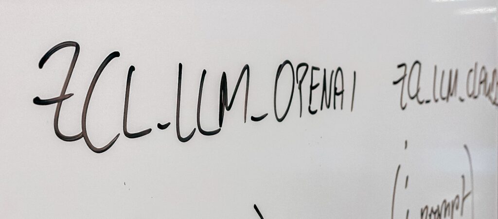 a close up of a white wall with writing on it